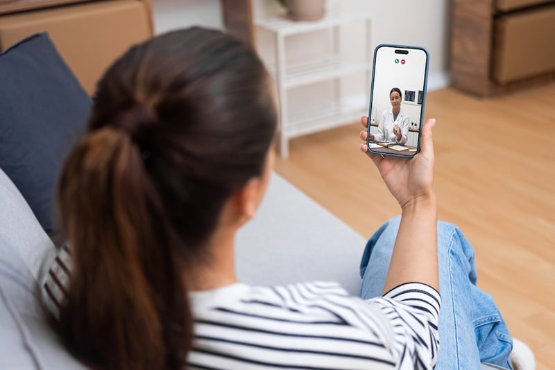 woman on phone virtual doctor visit